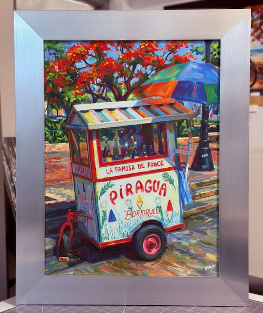 PR-103 Carrito de Piragüas La Famosa de Ponce – Canvas expuesto enmarcado con Montura silver 23″x29″ PR-103 Carrito de Piragüas La Famosa de Ponce - Canvas expuesto enmarcado con Montura silver 23"x29"